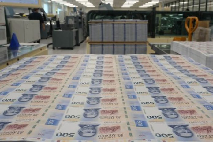 Mexican pesos being printed in a mint