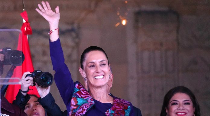 Claudia Sheinbaum waves to the crowd in Mexico City