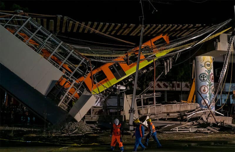 Firefighters and Civil Protection personnel work at the site of the Mexico City metro accident in May.