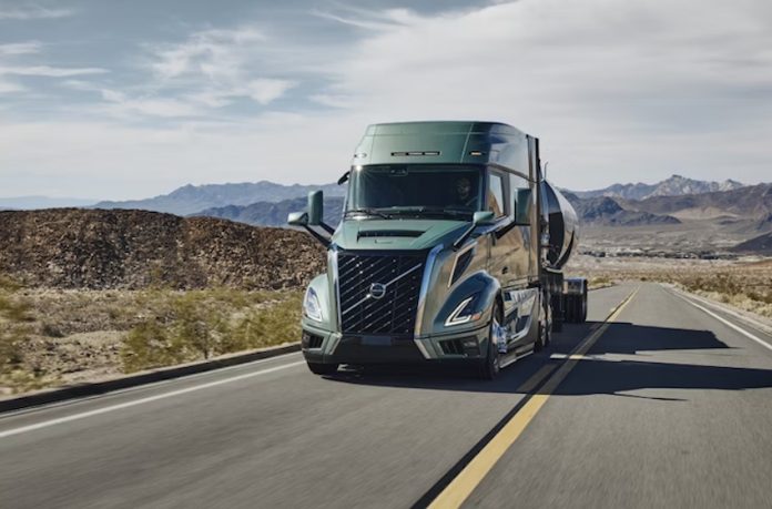 A Volvo truck driving down a highway